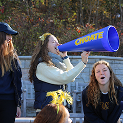 Photo of a student using a megaphone. Link to What to Give
