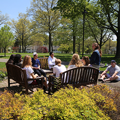 Photo of students sitting together outside. Links to Donor-Advised Funds